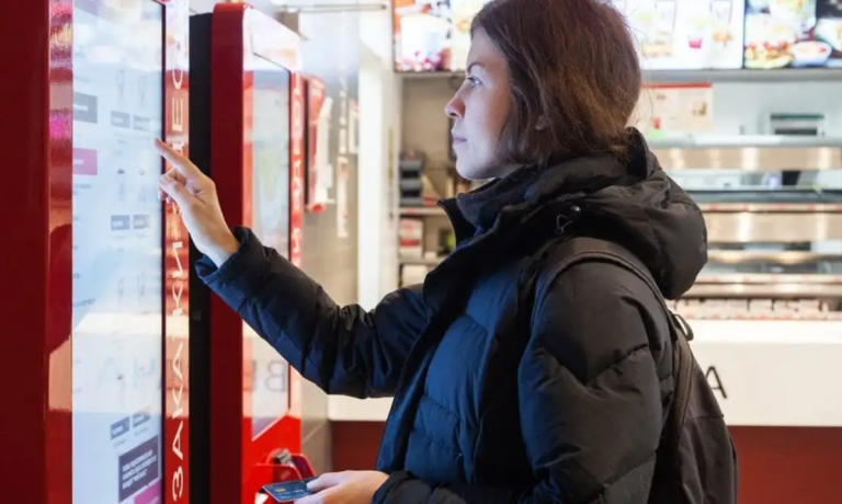 woman at self-service machine